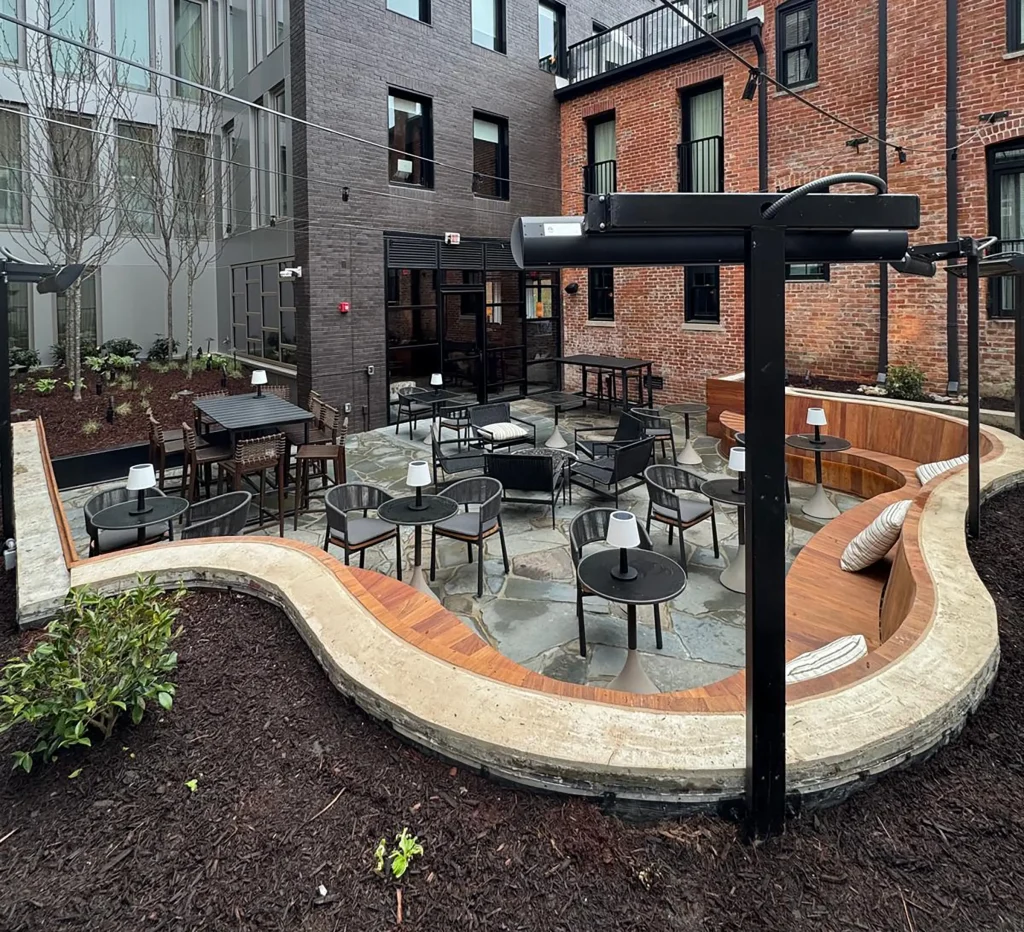 Commercial patio with restaurant seating and landscaping