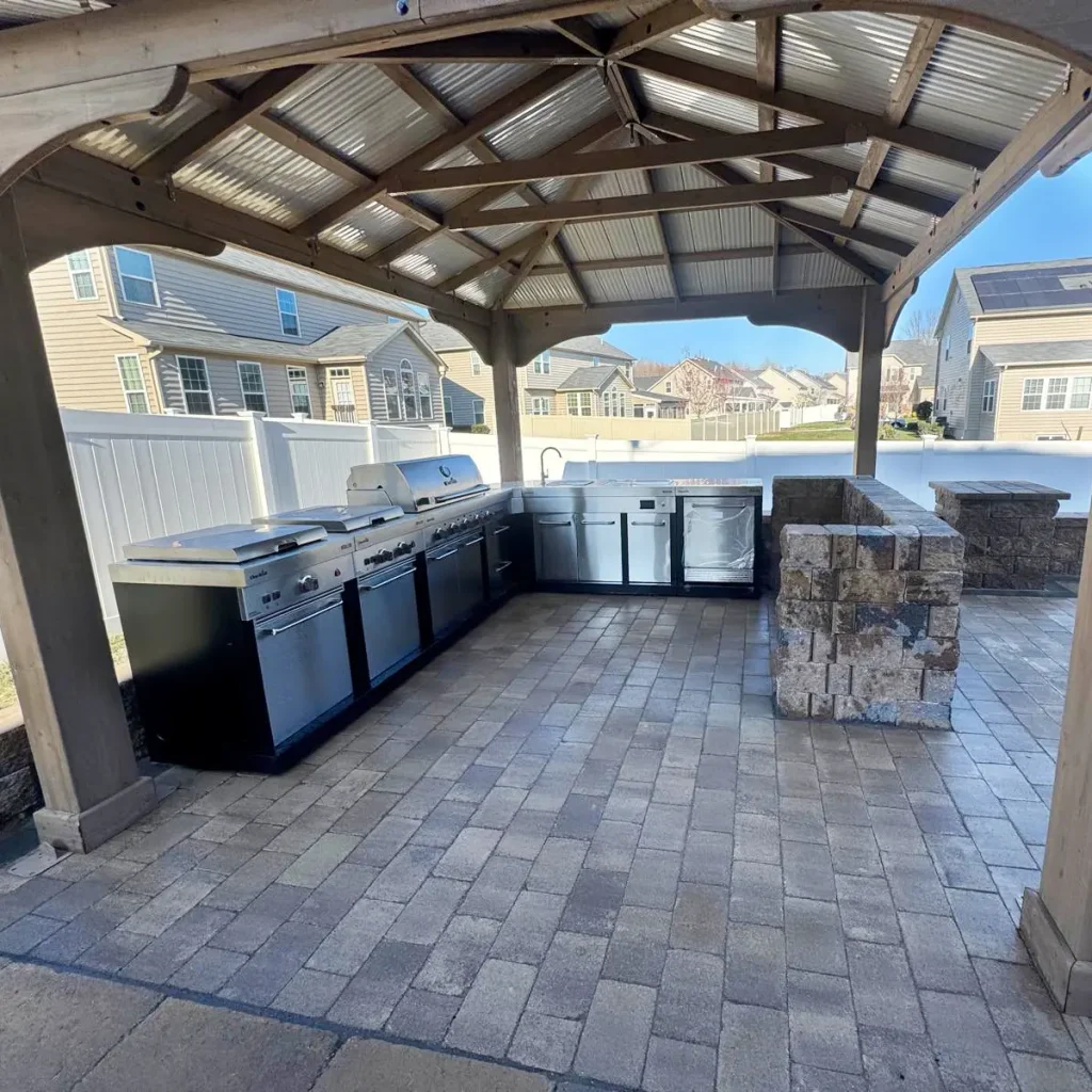 Outdoor patio and kitchen with gazebo roofing